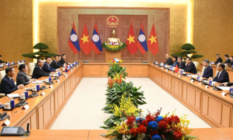 Lao Party Official Meets Vietnamese General Secretary and President in Hanoi